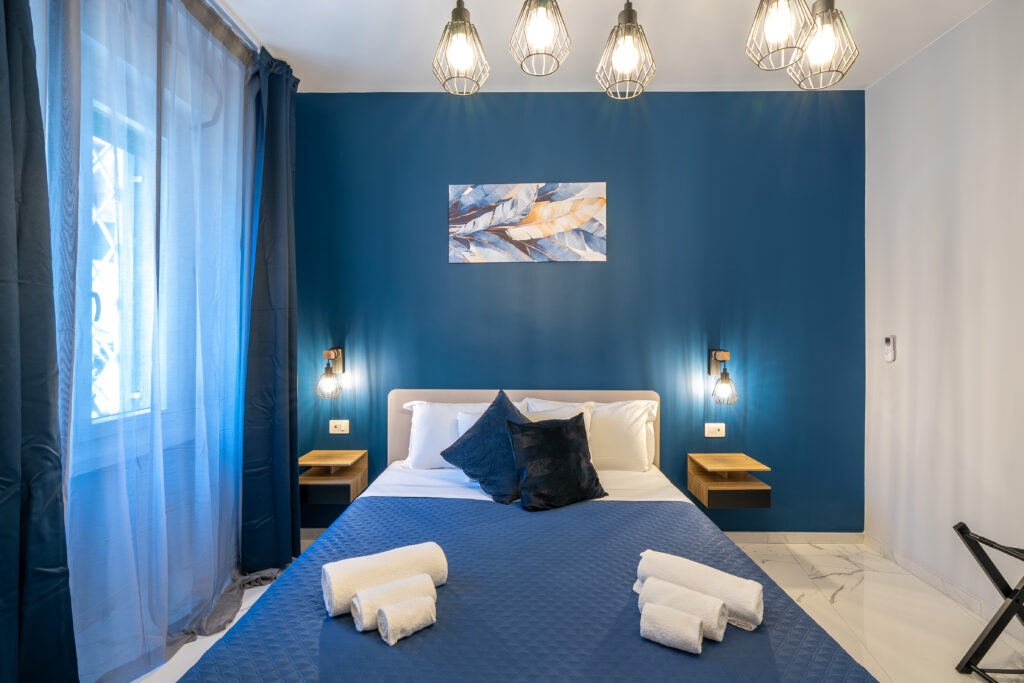 Stanza matrimoniale blu 008 di Olimpic Rome Luxury Rooms a Roma